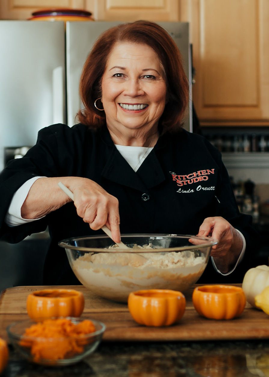 Chef Linda Orcutt cooking in her kitchen